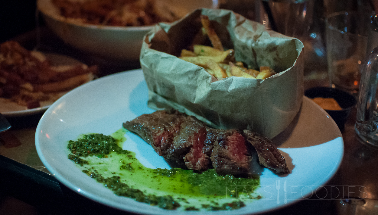 Steak Frites: Watercress cilantro chimichurri, truffled house cut fries, shaved pecorino from Hangover Pub in Worcester, MA