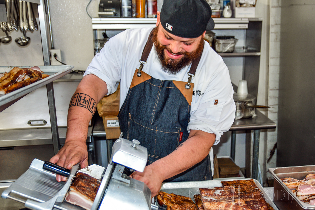 Chef Michael Arrastia preparing bacon at Hangover Pub on Green Street in Worcester, MA (Photograph by Alex Belisle)