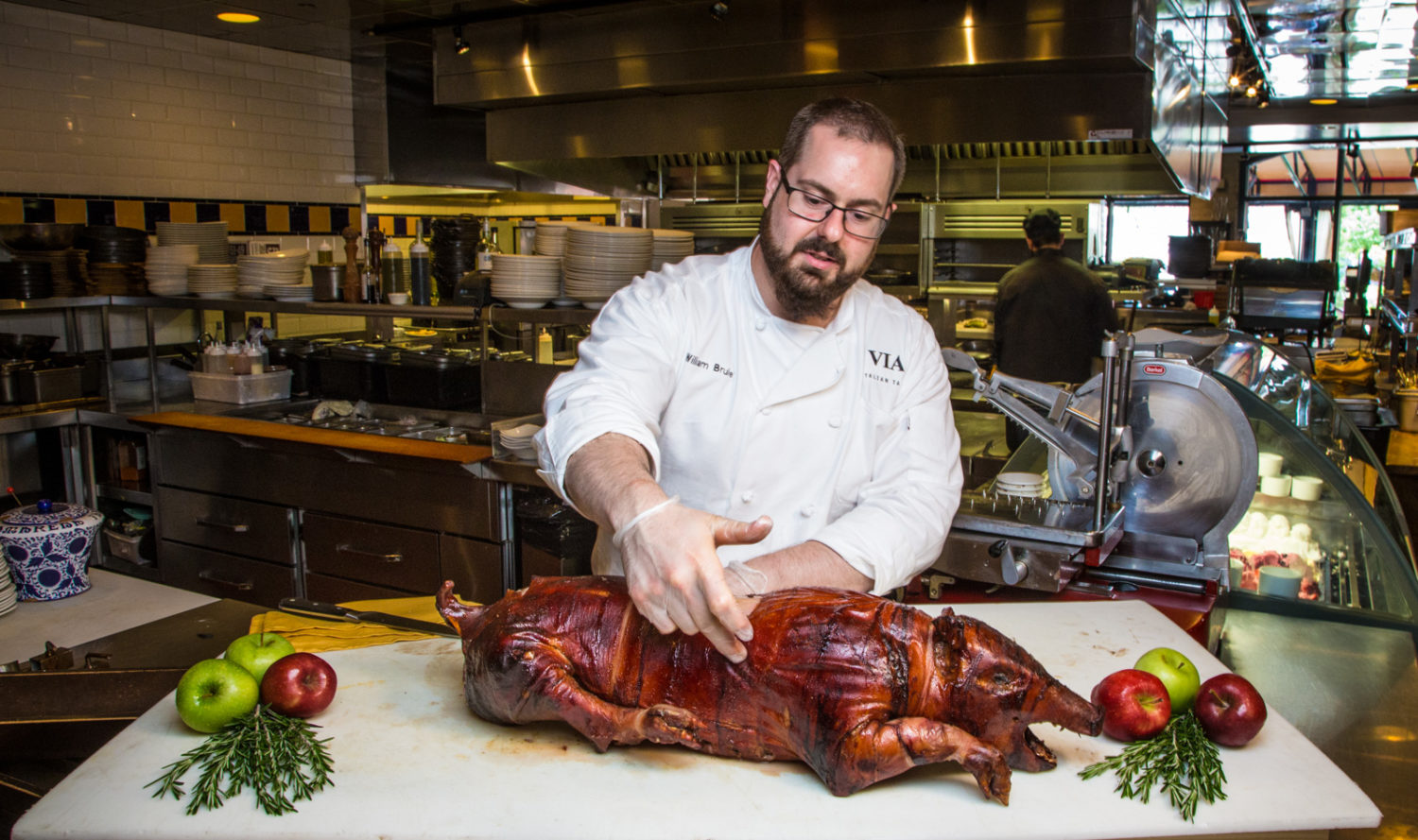 VIA’s executive chef, Bill Brule, Roasting a Pig for VIA's Italian Pig Roast.