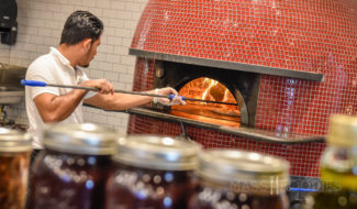 Cooking in the wood fire at Dacosta's Pizza Bakery (Photo for Mass Foodies by Belisle Images)