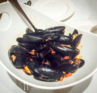 Mussels Fra Diavolo - sautéed mussels, fresh basil and tomato sauce.