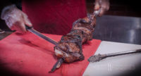 Carefully slicing meat at Terra Brasilis on Shrewsbury Street in Worcester, MA