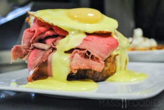 Roast Beef Sandwich – Roast beef, smoked parsnip-potato mash, Gruyere, horseradish hollandaise, a fried egg, served open faced on fresh baked sourdough, side of dressed greens.