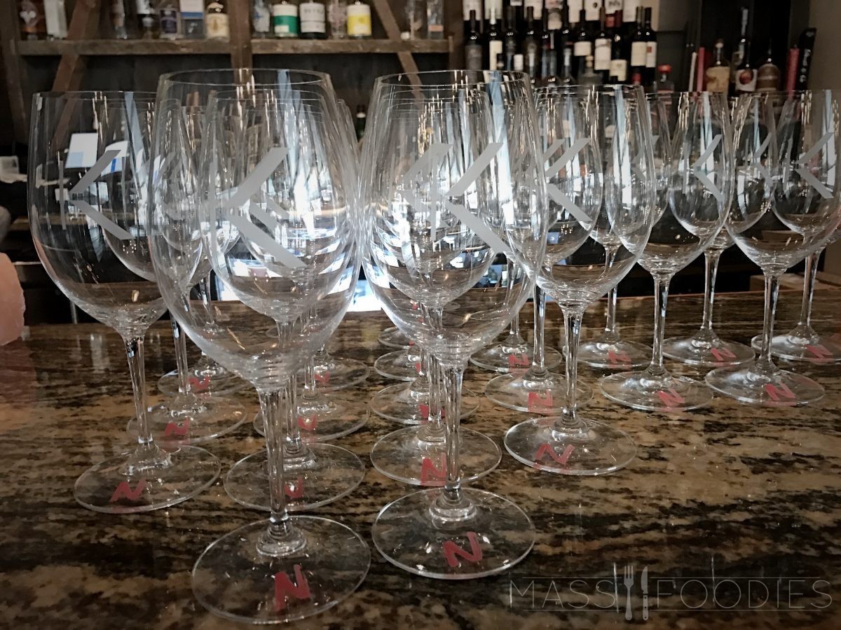 Wine glasses ready for Lock 50's North versus South wine event on Water Street in Worcester, MA