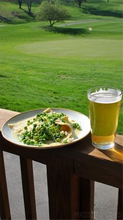 The Civic Kitchen & Bar's Feta and ricotta stuffed raviolo with parmesan, peas, pea shoots, and lemon butter paired with Banded Horn Pepperell Pilsner.