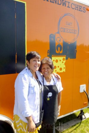 Teri Goulette, owner of Say Cheese!, posing with her mother outside of the food truck.
