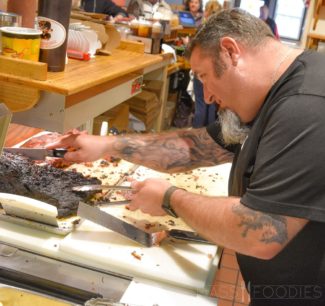 Brian Treitman carving brisket at B.T.’s Smokehouse (Alex Belisle for Mass Foodies)