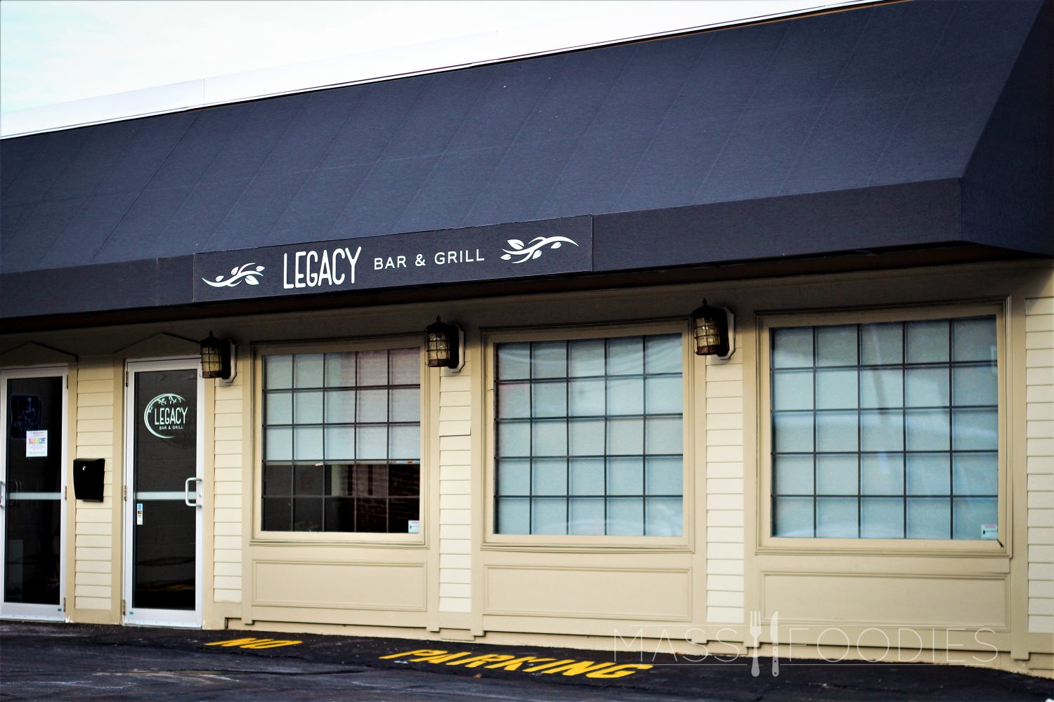 The facade of Legacy Bar & Grill at Coe's Pond on Mill Street in Worcester, MA.