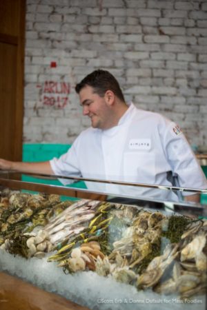 Executive Chef Jared Forman standing behind the raw bar display at simjang on Shrewsbury Street in Worcester, MA (Erb Photo for Mass Foodies)