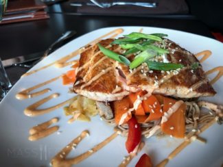 110 Sesame Ginger Salmon at 110 Grill in downtown Worcester, MA (PAN-SEARED SALMON OVER MARINATED CHILLED SOBA NOODLES, TOSSED WITH ASIAN SLAW AND SESAME GINGER DRESSING, TOPPED WITH SESAME SEEDS AND FINISHED WITH SRIRACHA AIOLI.)