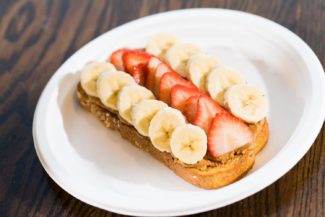 STEAM dresses up its Cashew Almond Toast with freshly sliced banana and strawberries. (STEAM)